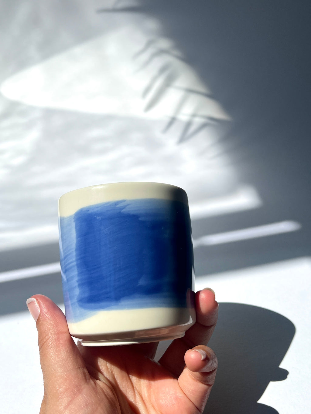 Porcelain cup - blue brushstroke