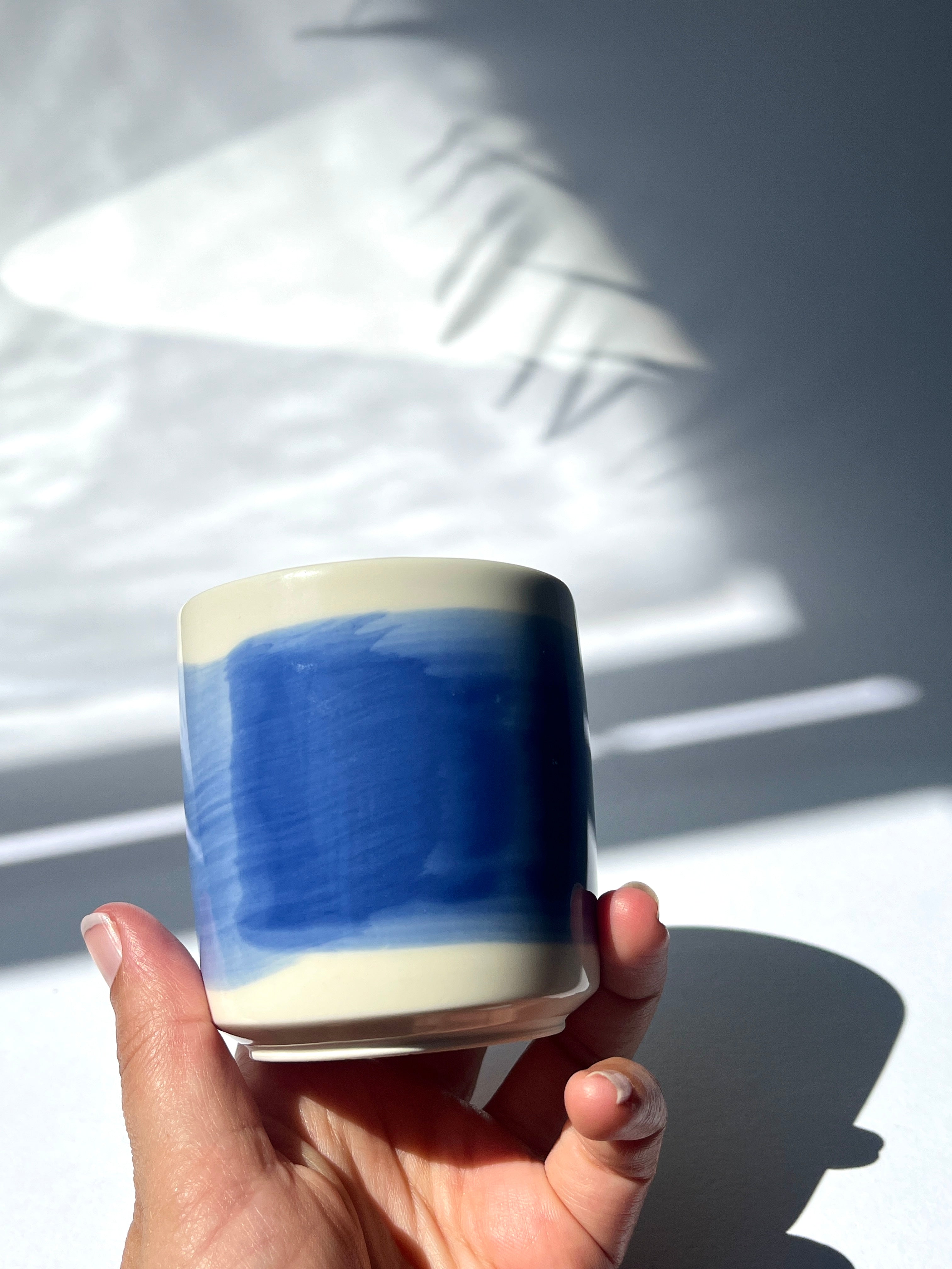 Porcelain cup - blue brushstroke
