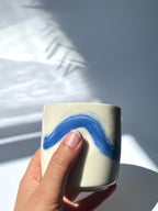 Dimpled porcelain cup - blue brushstroke