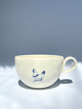 Pecking hen teacup