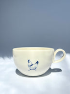 Pecking hen teacup