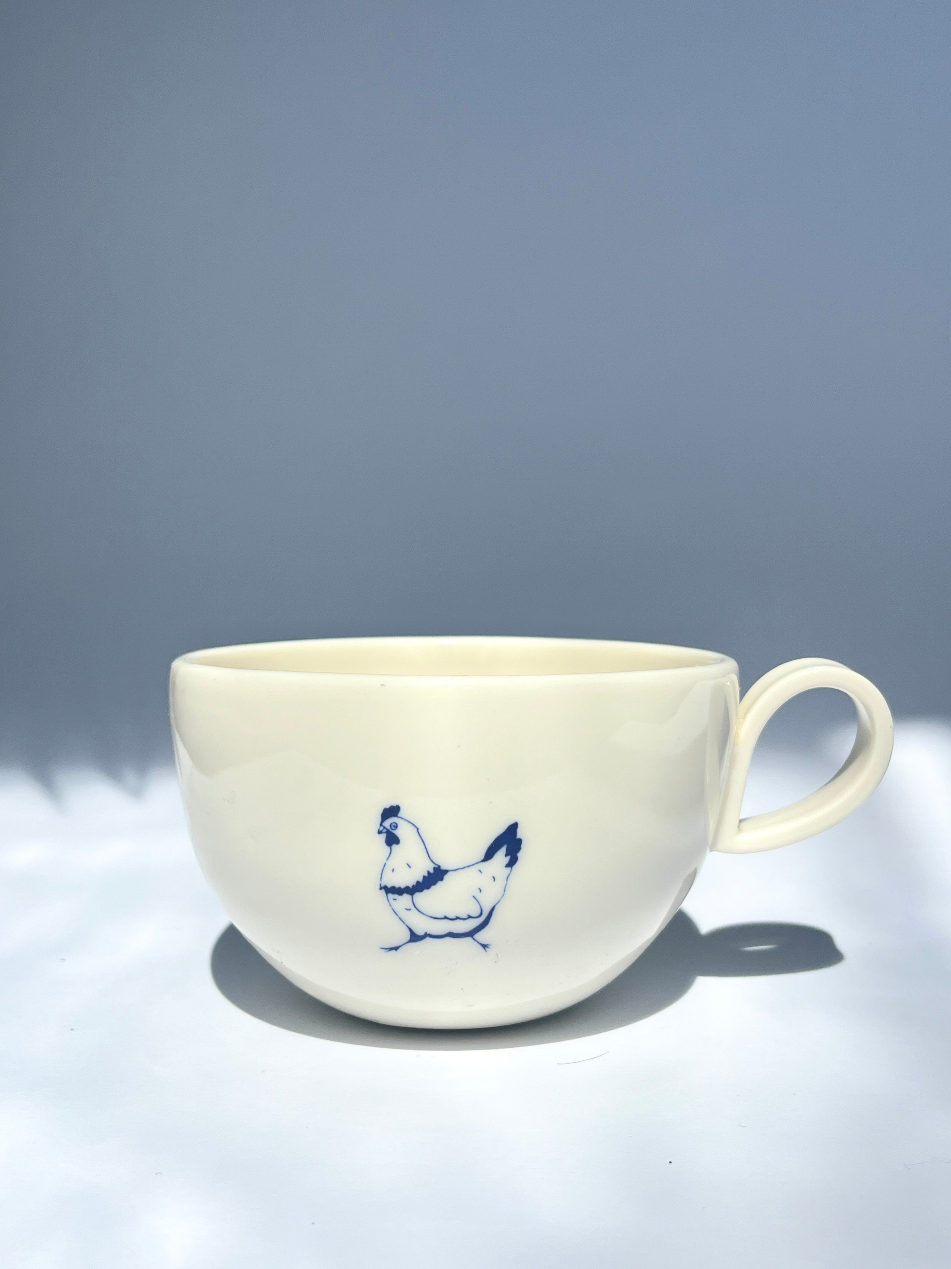 Pecking hen teacup