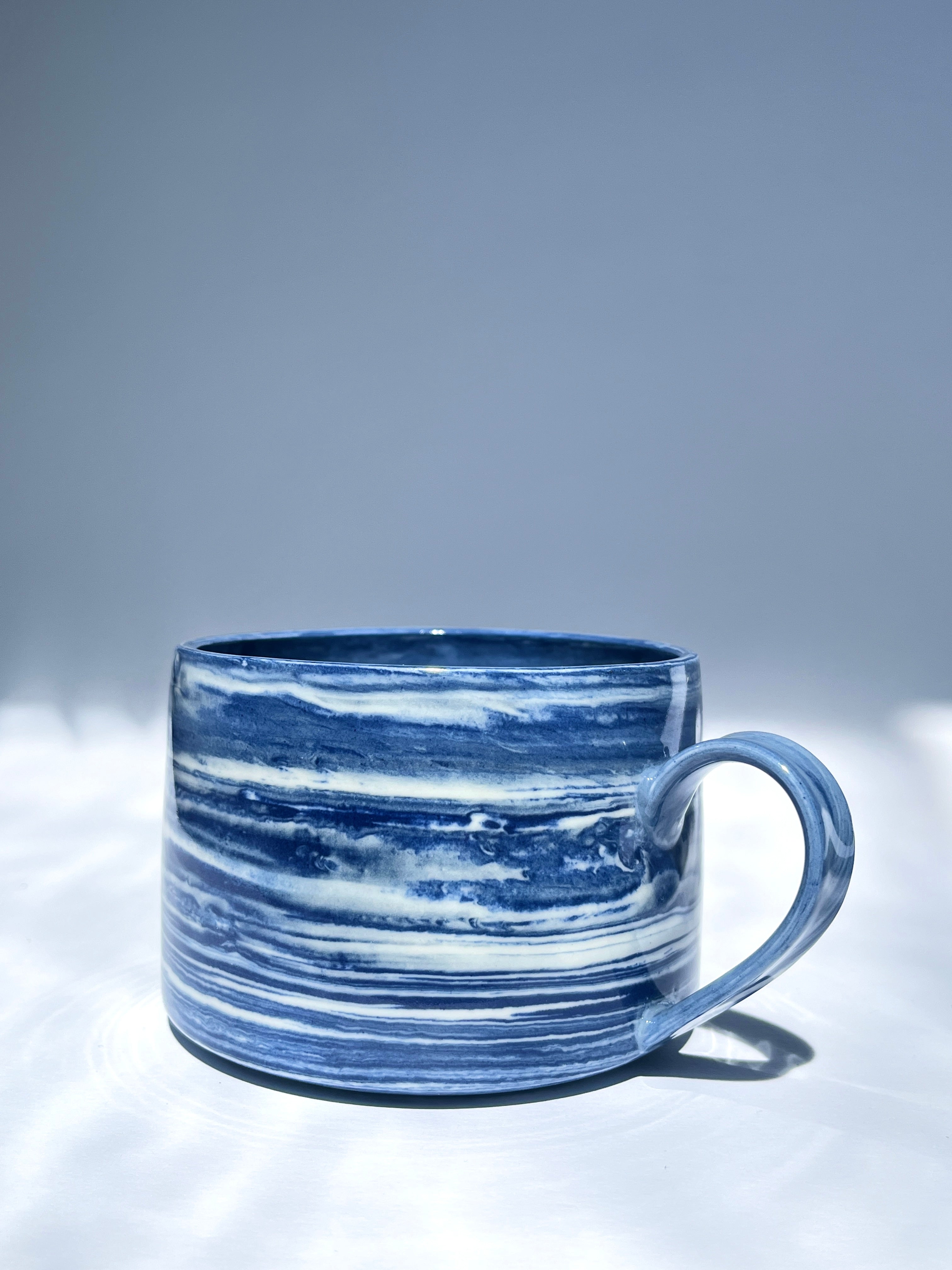 Dark blue marbled coffee cup