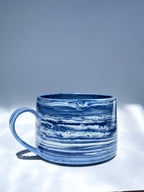 Dark blue marbled coffee cup