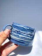 Dark blue marbled coffee cup