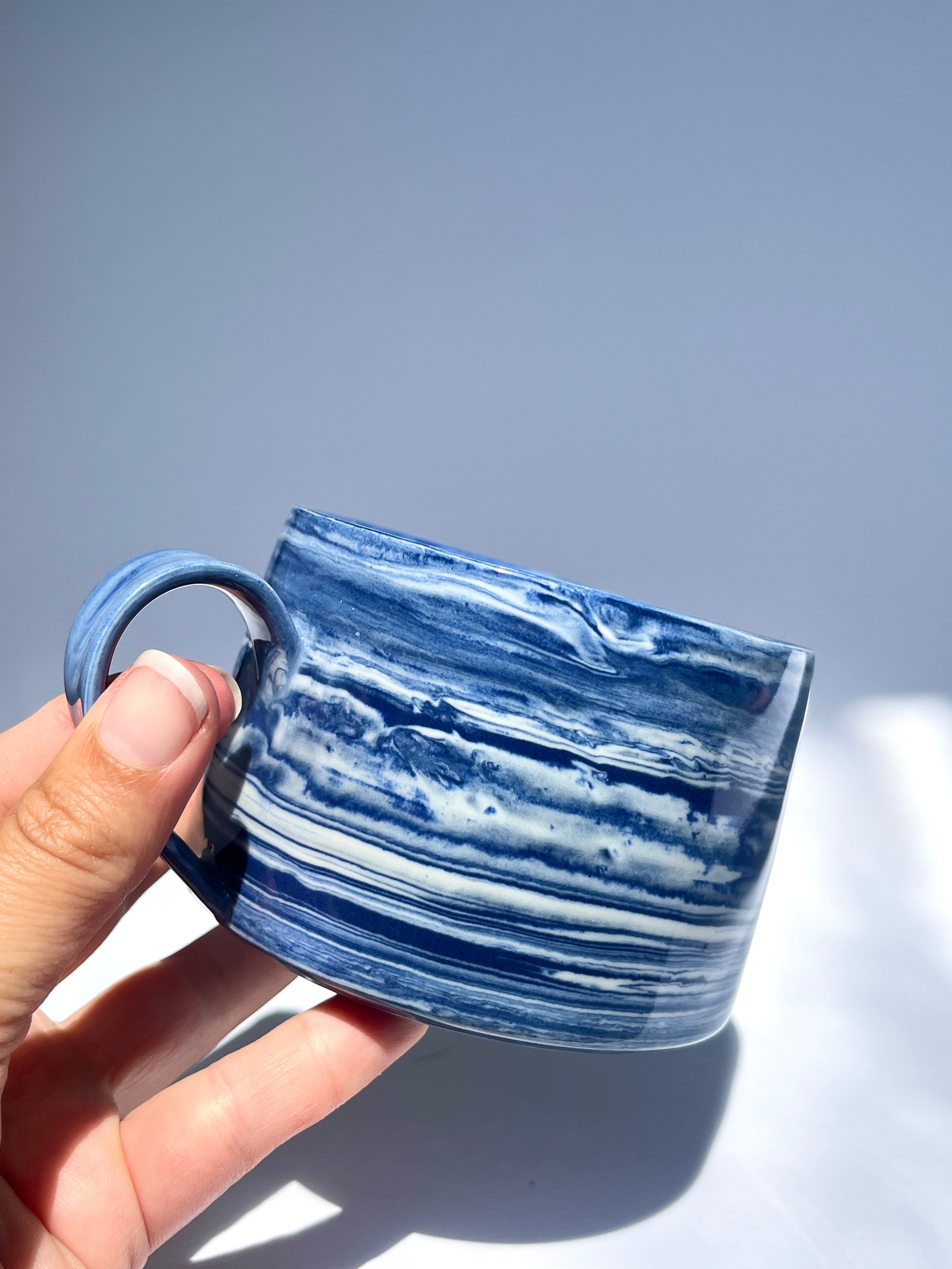 Dark blue marbled coffee cup
