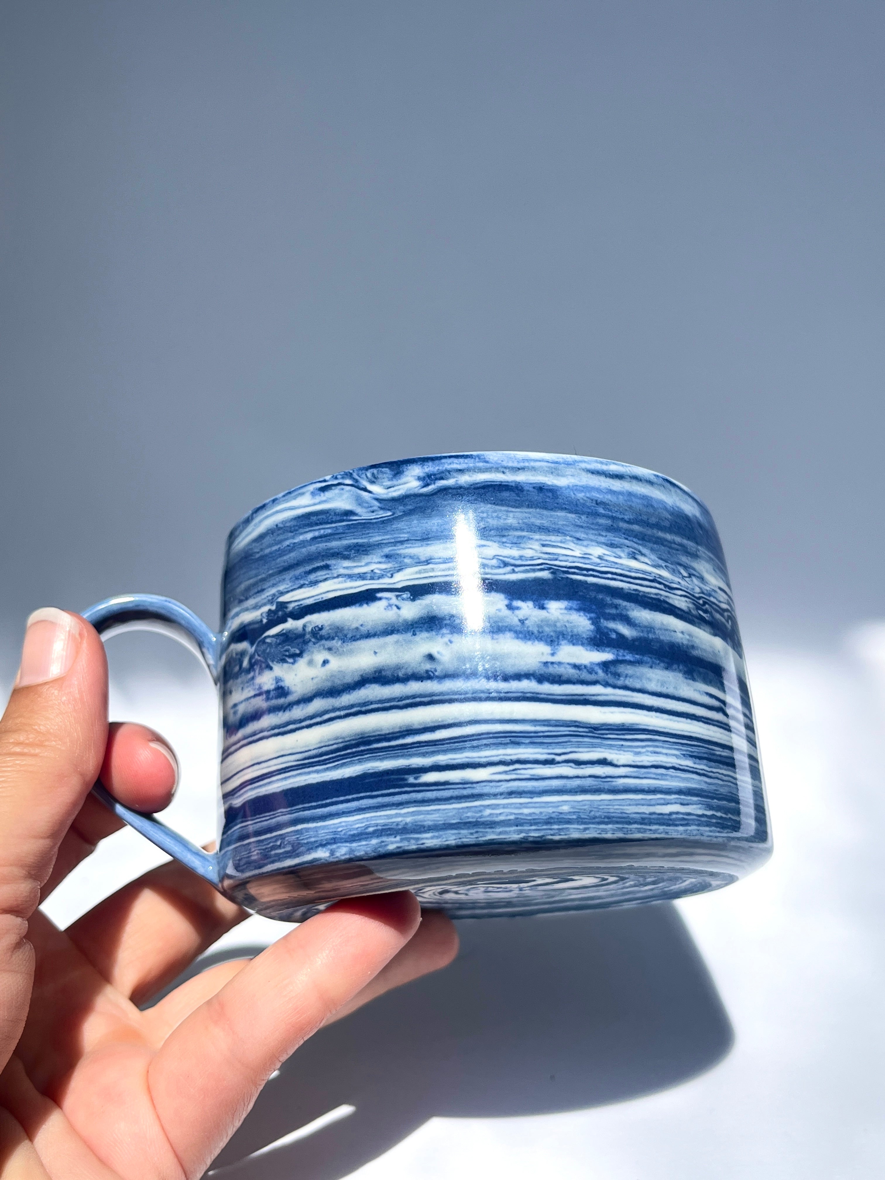Dark blue marbled coffee cup
